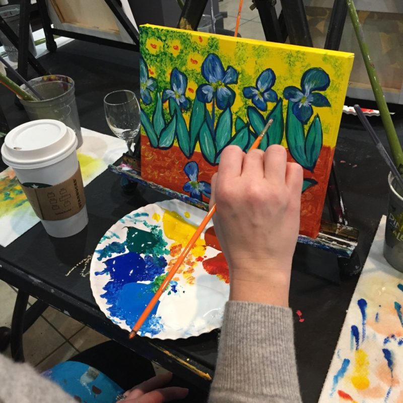 Meghan Slipka painting at an easel