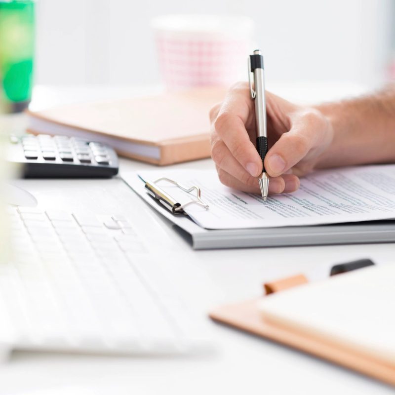 Person filling out forms