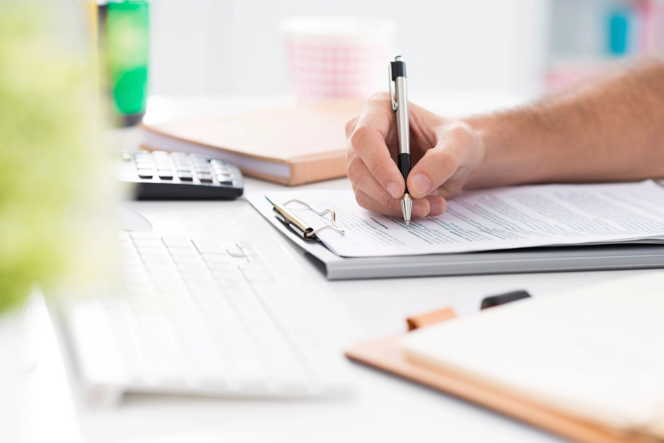 Person filling out forms