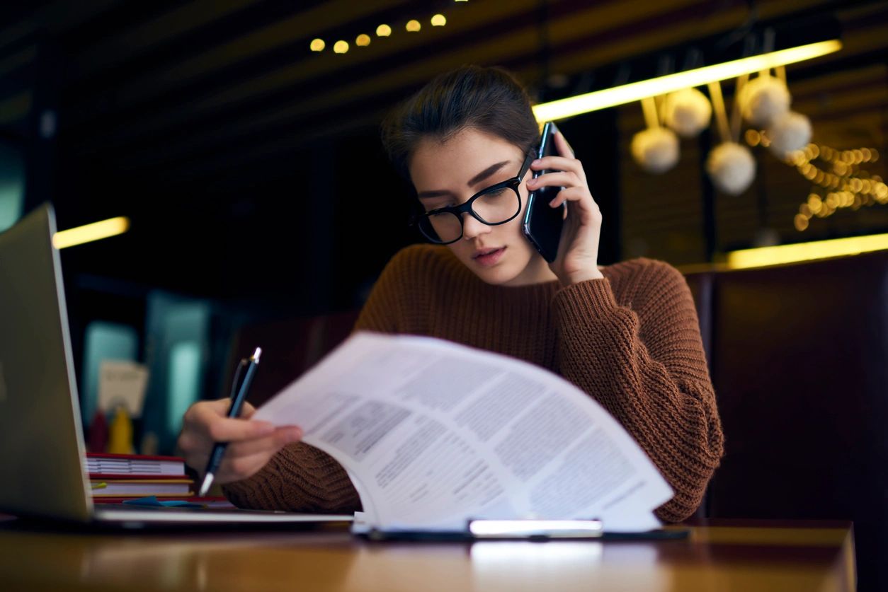 Business person reviewing contract papers