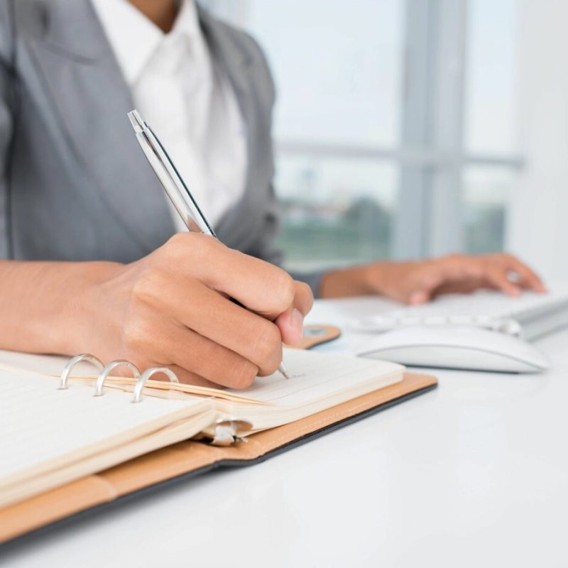 Business woman writing